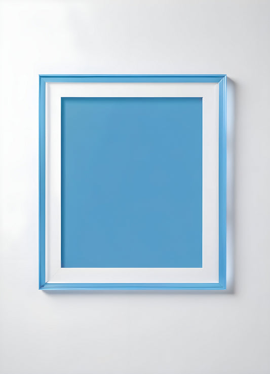 Empty framed blue canvas on a white wall in a minimalist design setting showcasing a modern artistic atmosphere