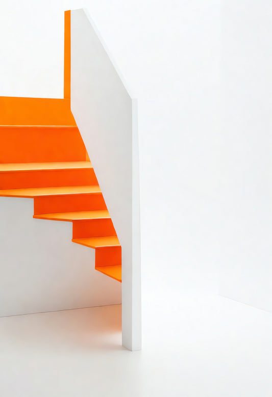 Modern orange staircase design in minimalistic interior space