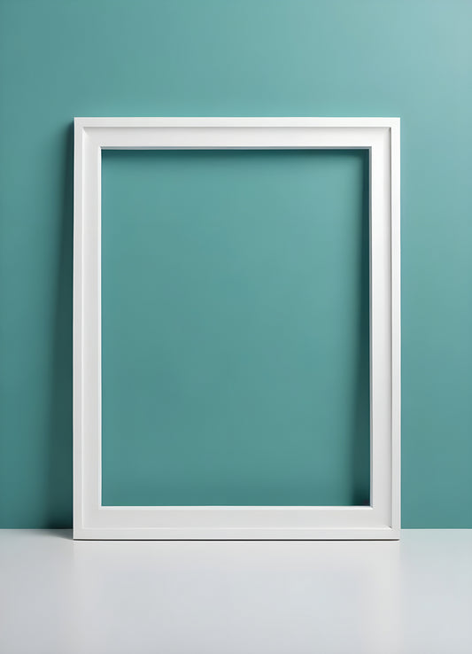 A blank white picture frame resting on a surface against a vibrant teal wall, providing an open canvas for creative expression