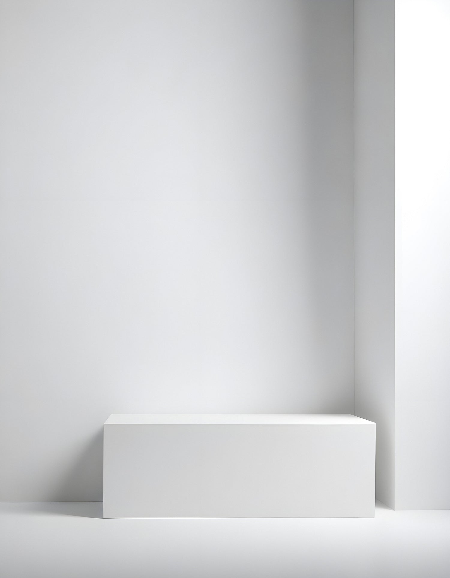 Minimalist white display box against a blank wall in a modern interior space