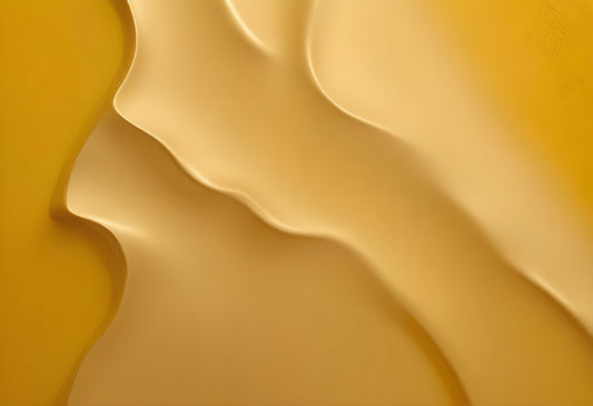 Abstract sand-like formations showcasing smooth, flowing curves in warm yellow tones, creating a serene and minimalist ambiance