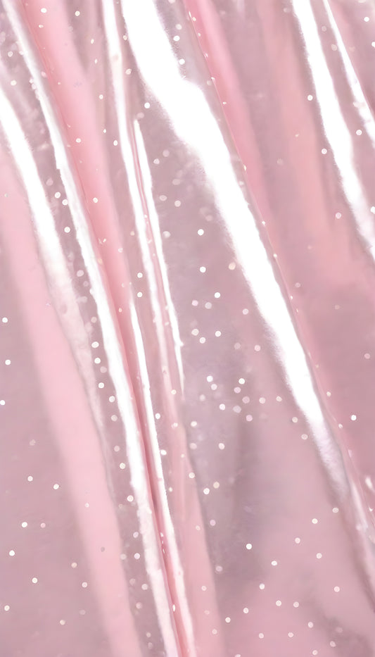 A close-up view of soft, shiny pink fabric draped elegantly, highlighting its smooth texture and sheen, perfect for luxurious designs