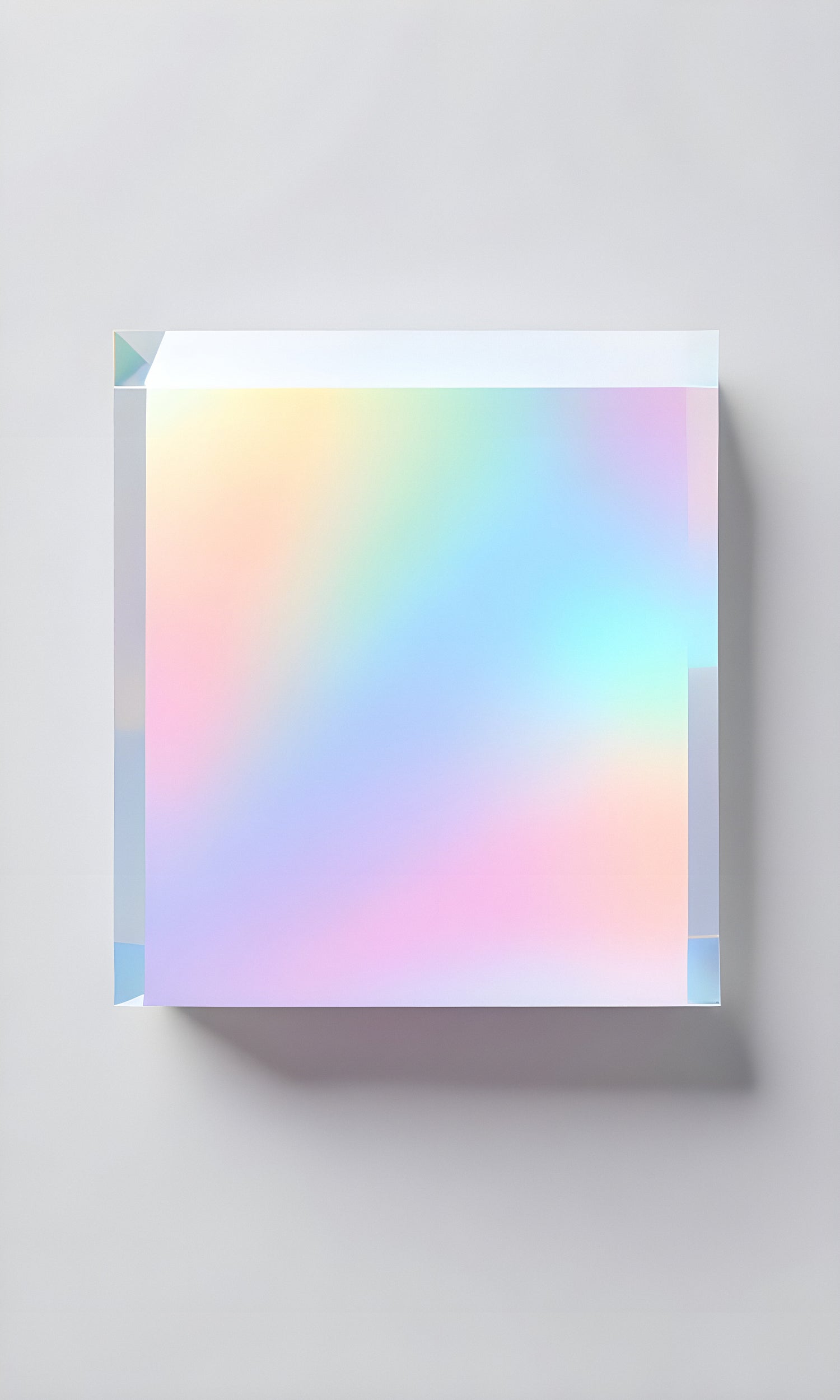 Translucent prism casting colorful light reflections on a smooth surface in a serene indoor setting during daylight hours