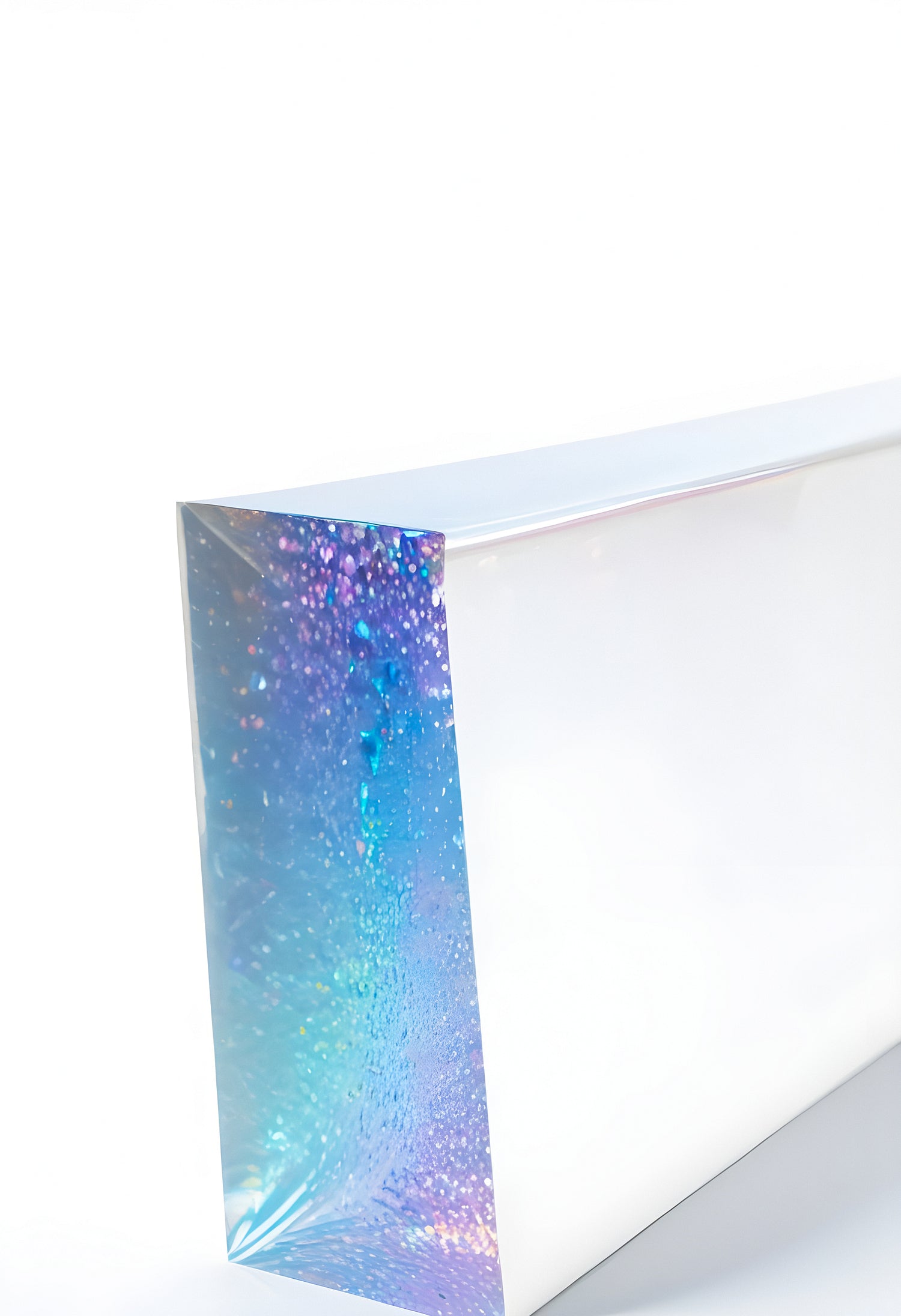 A shimmering, iridescent sheet showcases a gradient of blue and purple hues against a clean white background