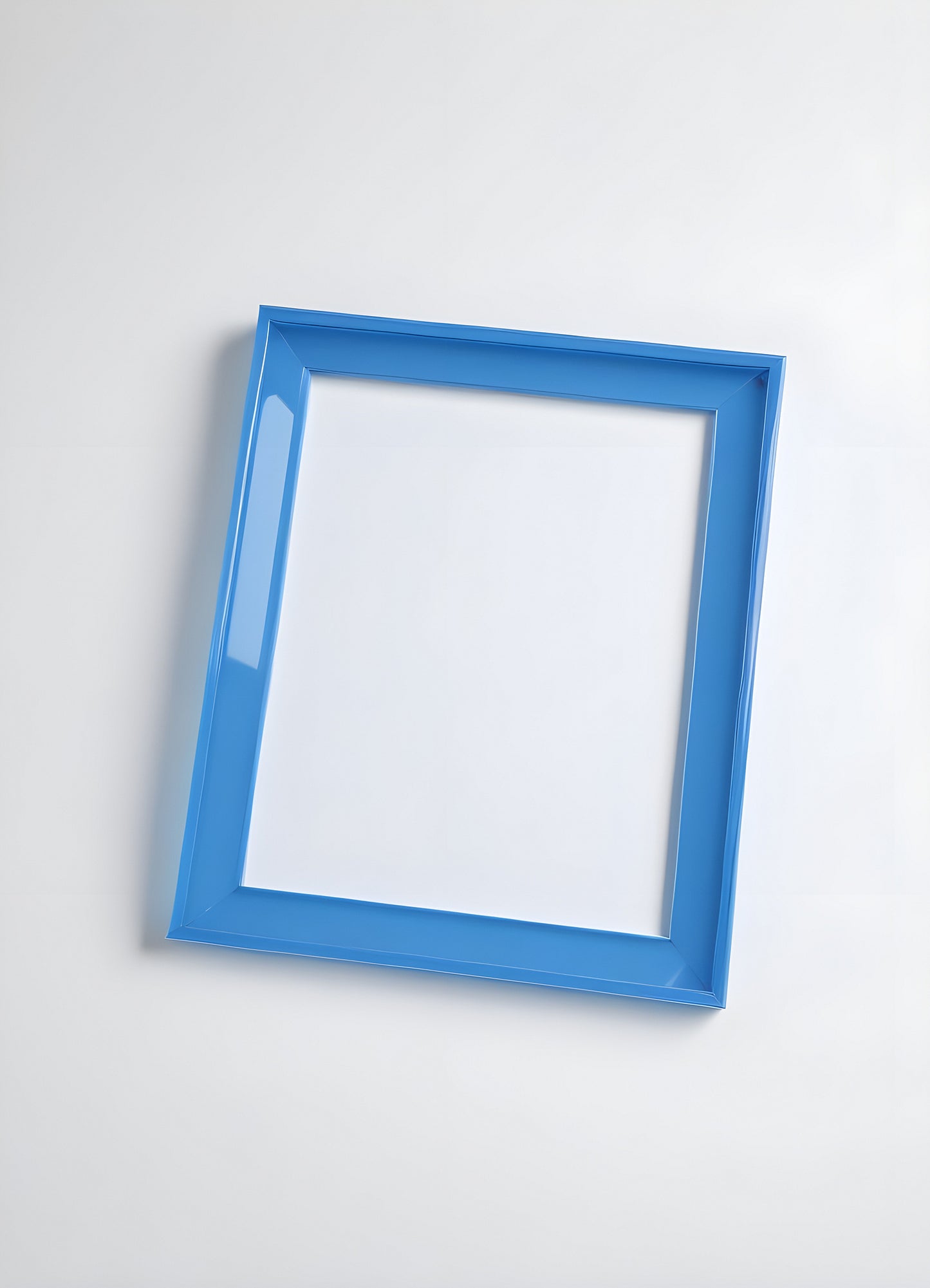 A bright blue picture frame leaning against a white background, creating a minimalist and contemporary aesthetic for showcasing art