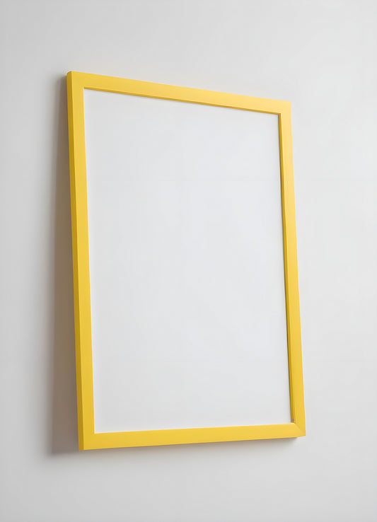 A bright yellow frame leaning against a simple white wall with a smooth surface and a minimalistic background