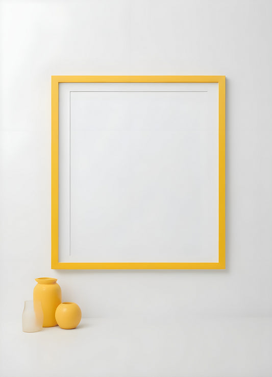 A minimalistic yellow frame on a white wall with a yellow vase and an apple, offering a serene and contemporary home decor aesthetic